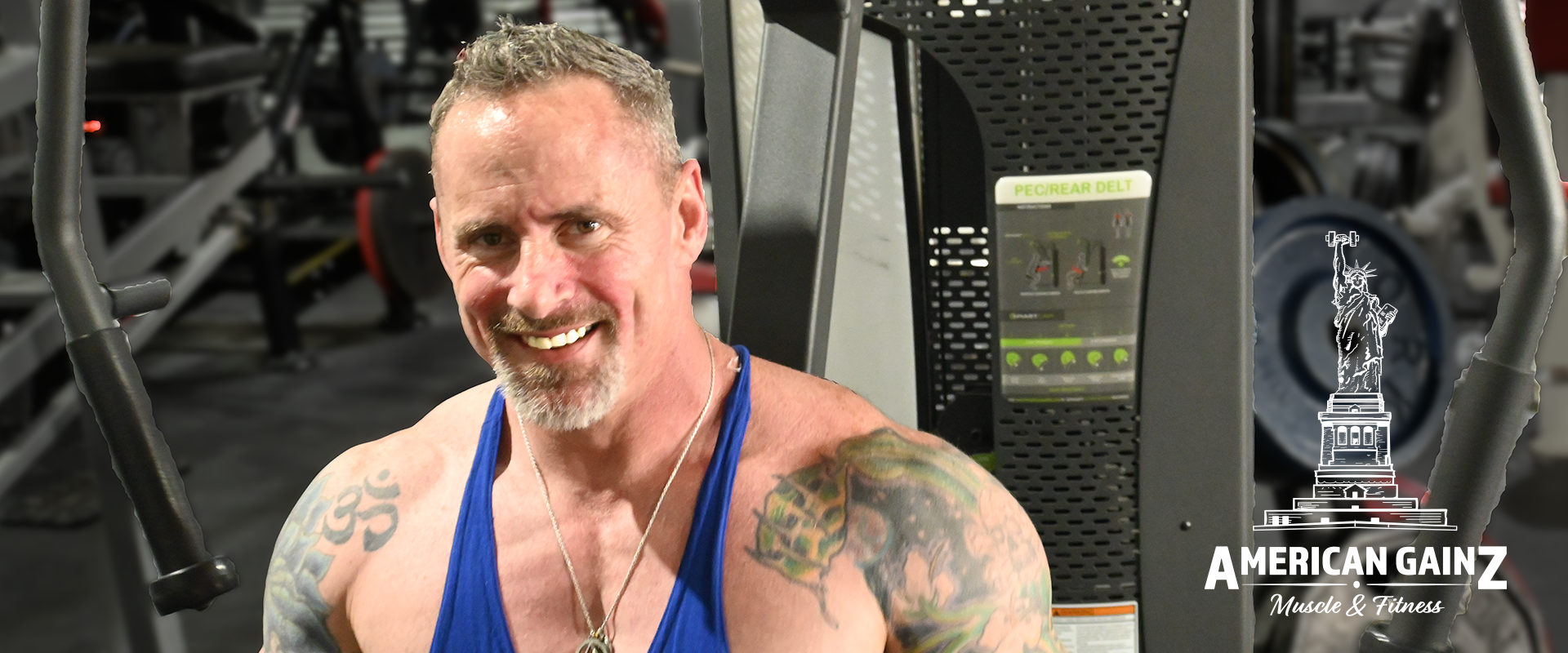 Personal Trainer, Greg Maloney, smiling whilst working out at Armbrust Pro Gym, in Colorado.